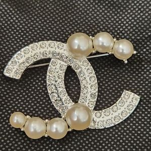 cc silver brooch